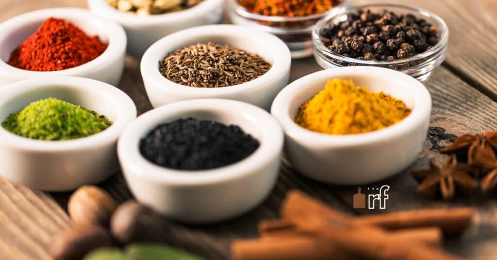 various herbs and spices in small bowls
