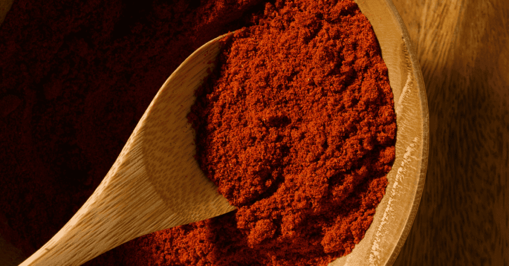 paprika in wooden spoon