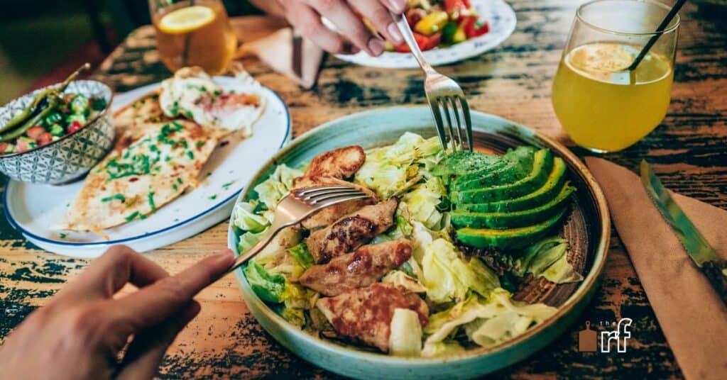 people sharing plates of food