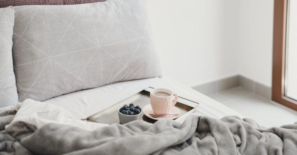 breakfast tray with tea and fruit on bread