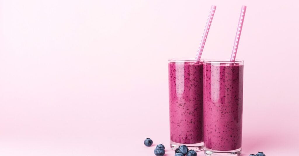 wild blueberry dragon fruit smoothie with straw