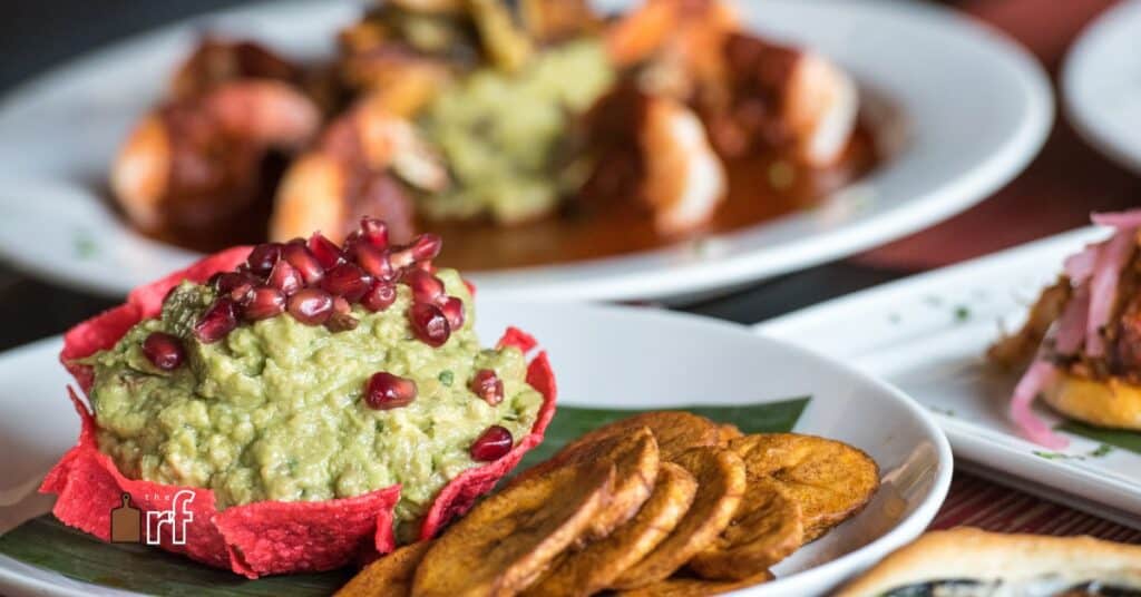 guacamole with pomegranate seeds and crackers