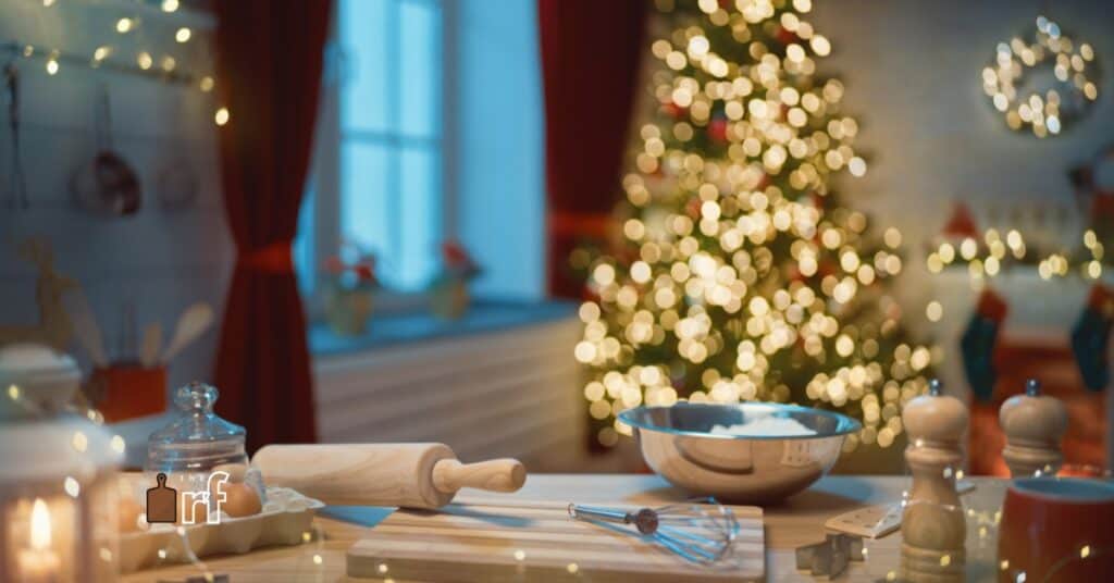 kitchen counter with baking utensils and christmas tree in background