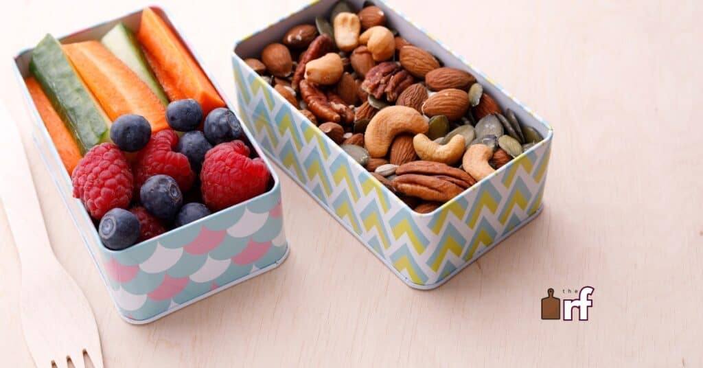 snack tins with nuts fruits and veggies